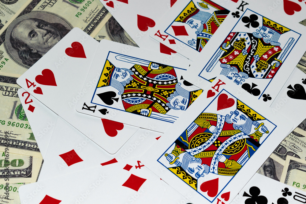 Mixed randomly lying cards on the background of banknotes Mixed randomly lying cards on the background of banknotes