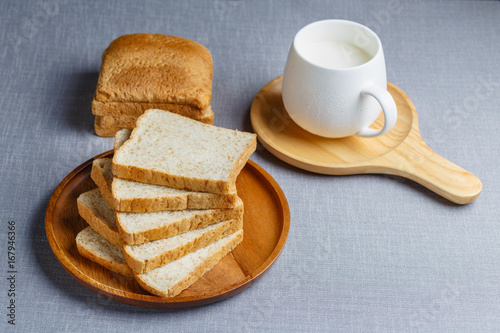 Whole Wheat Bread and milk on gray cloth