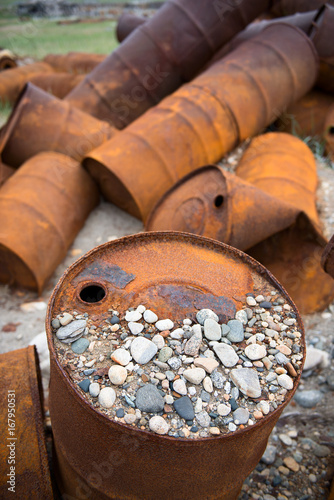 Rusted barrels on the shore, Chukotka, Russia