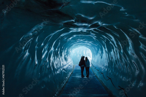 Ice cave Mer de Glace in France with two people photo