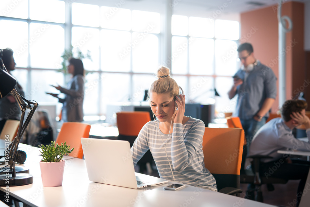 businesswoman using a laptop in startup office businesswoman using a laptop in startup office