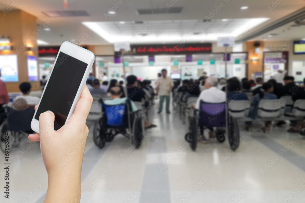 Obraz premium women hand holding smart phone to call relative to wait while waiting for receive medicine. medical emergency call concept. patient using mobile while wait to pay for bill.
