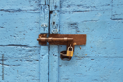 lock on a blue wooden door