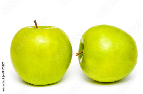 Two fresh green apples on isolated white background