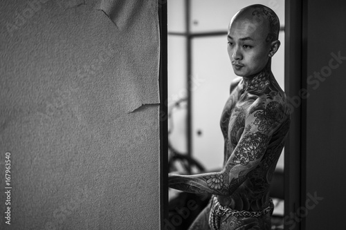 Young tattoo apprentice preparing for a photo shooting photo