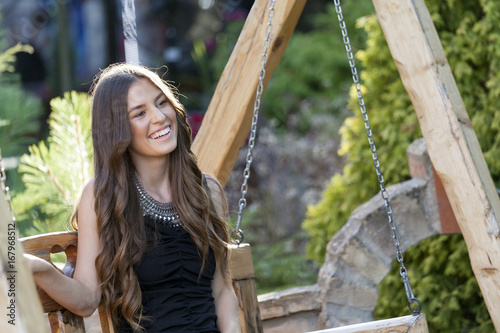 Beautiful teenage girl in park in summer