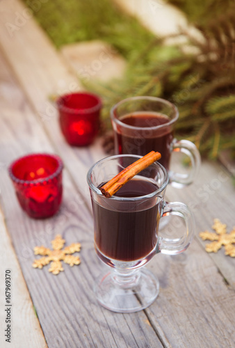 christmas concept mulled wine hot alcoholic drink with spices garnished autumn leaves space for text