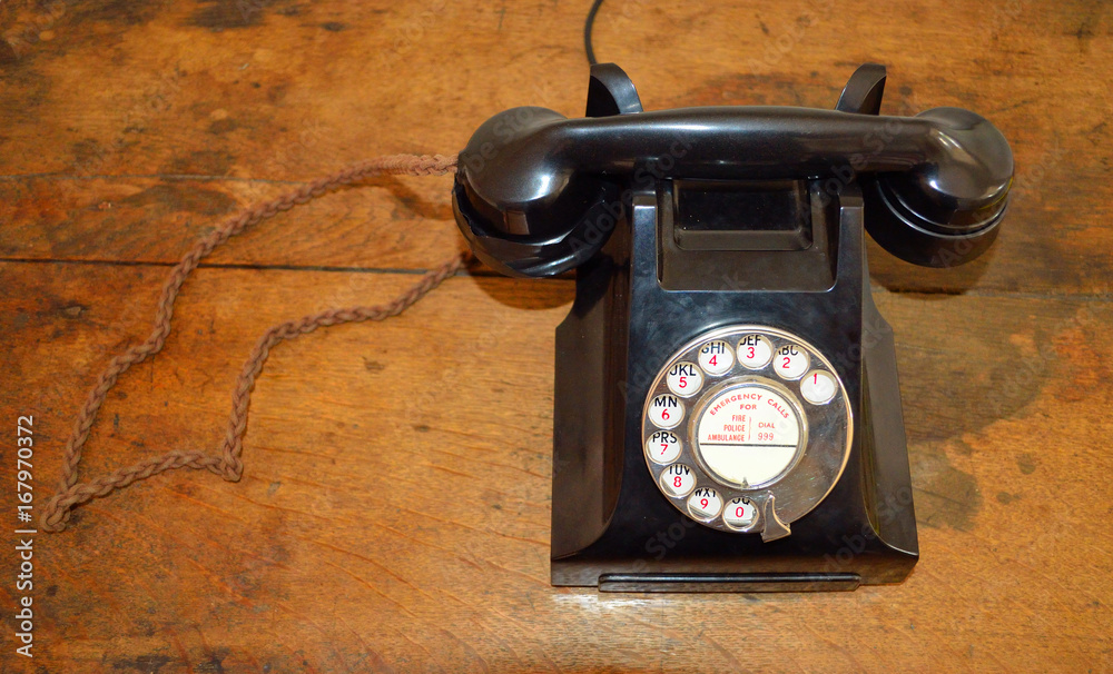 Vintage Telephone on timber table top.