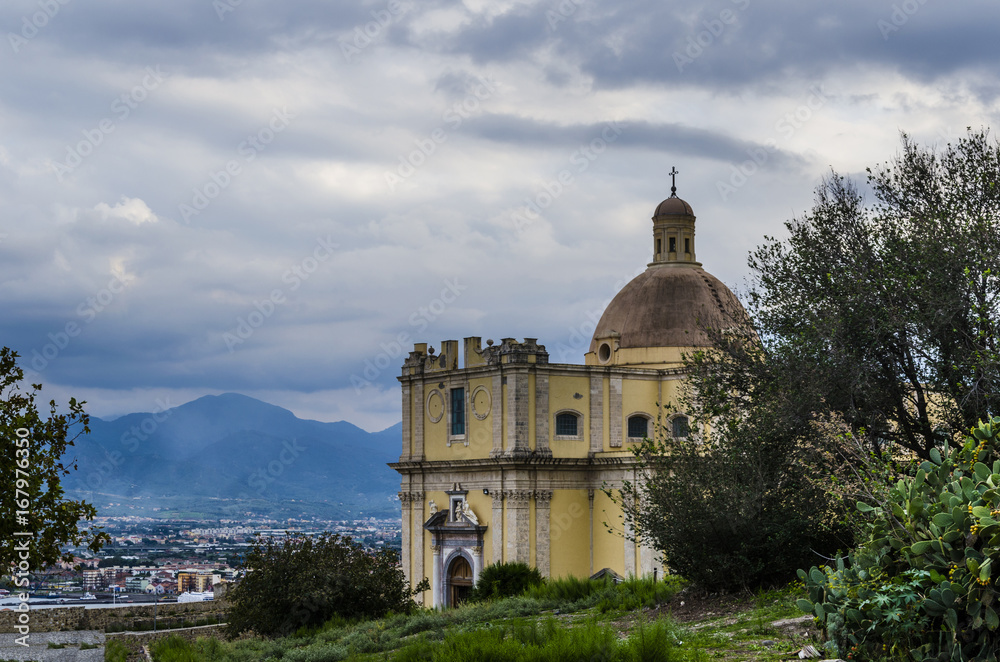 Church the city of milazzo and mountains background