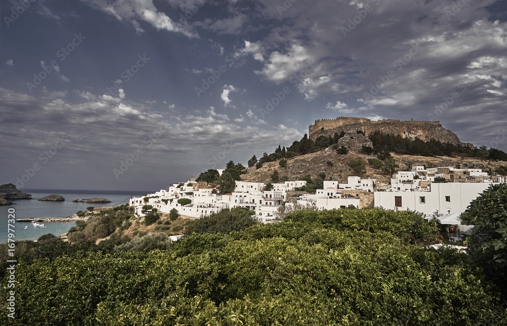 Medieval fortress and white houses of Lindos village in Rhodes.