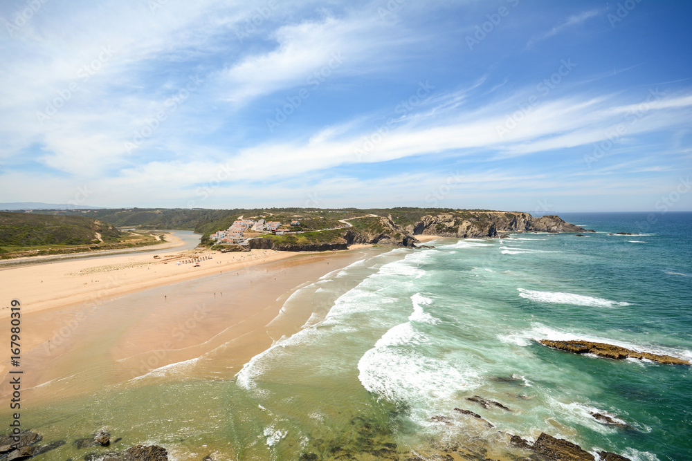 View from the cliffs to surfer beach Praia de Odeceixe, District Aljezur - Algarve Portugal