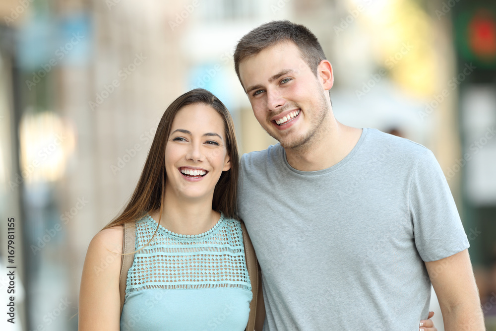 Fototapeta premium Happy couple walking together on the street