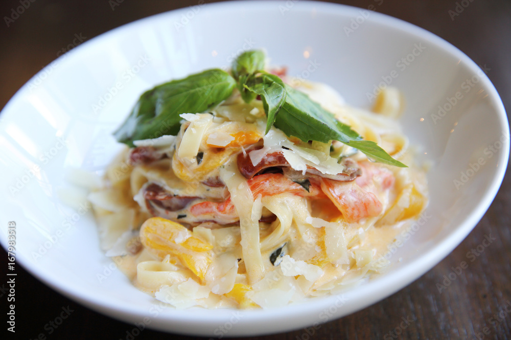 Chorizo sausage spaghetti fettuccine on wood background