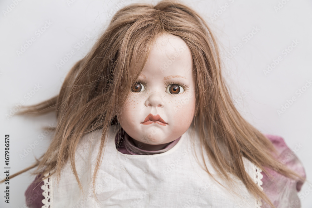 Ceramic porcelain handmade doll with blond hair and violet dress Ceramic porcelain handmade doll with blond hair and violet dress