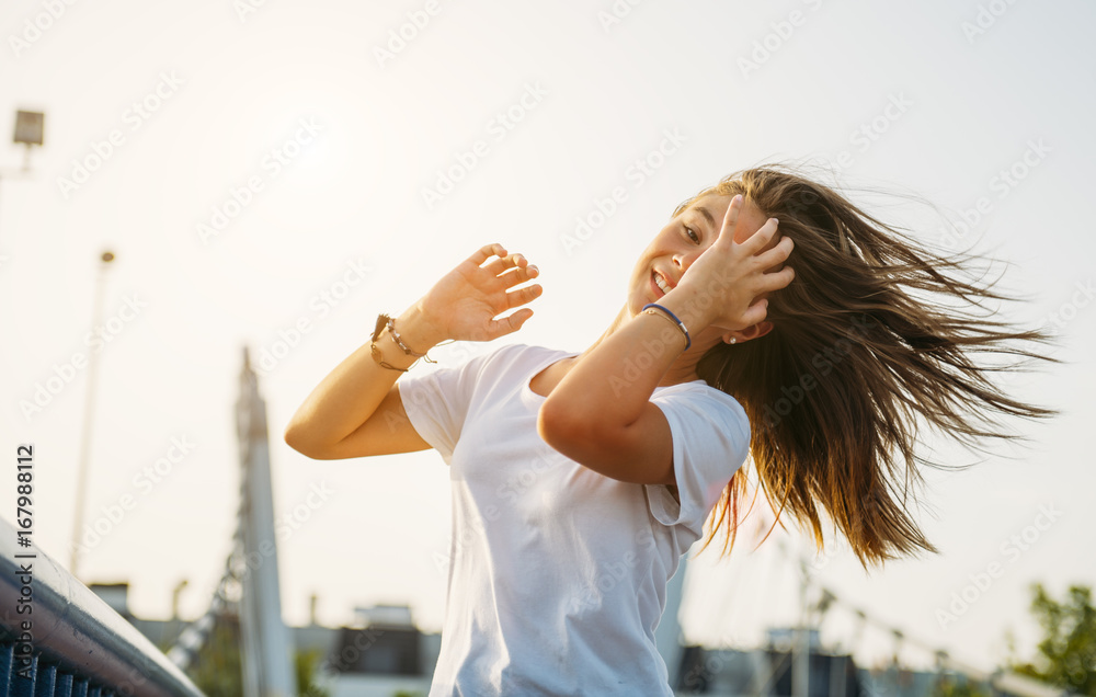 Cheerful woman posing on bridge Cheerful woman posing on bridge