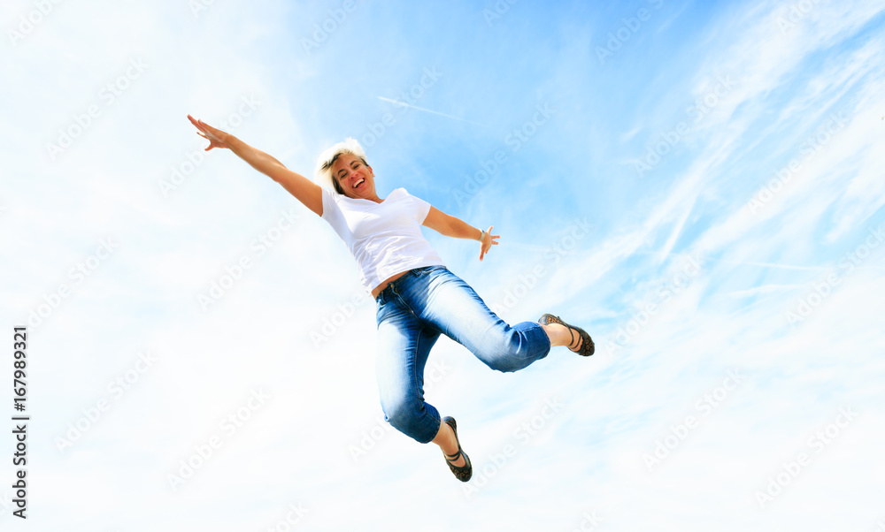 Woman In Her 50s Jumping High