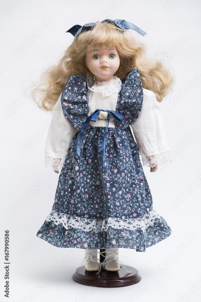 Ceramic porcelain handmade doll with long blond hair and blue dress Ceramic porcelain handmade doll with long blond hair and blue dress