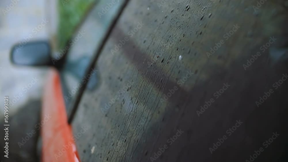 The rain knocks on the car's glass. The rain knocks on the car's glass.