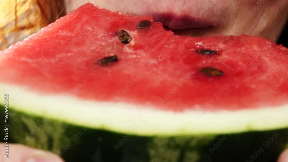 Closeup of mature woman eating fresh red watermelon fruit. Healthy food organic nutrition. 4K ProRes HQ codec Closeup of mature woman eating fresh red watermelon fruit. Healthy food organic nutrition. 4K ProRes HQ codec