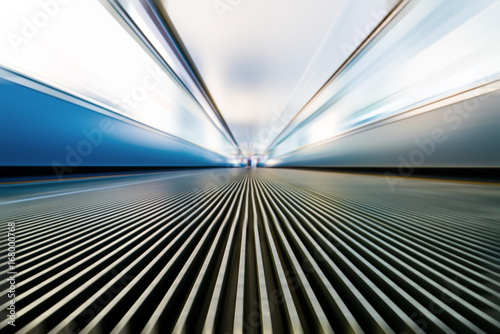 Slika na platnu Moving walkway and light on background.