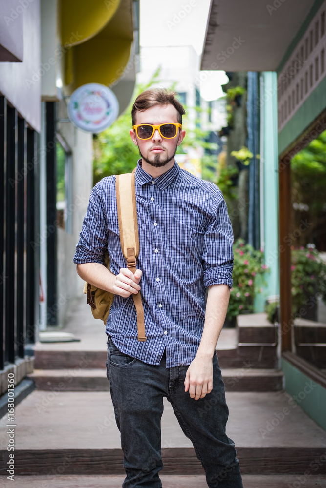 Young handsome man traveling backpacker in Chiang Mai outdoor market alone, travel alone concept Young handsome man traveling backpacker in Chiang Mai outdoor market alone, travel alone concept