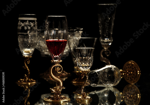 Isolated beautiful antique wineglasses in black background