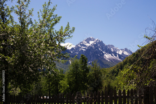 Mountainous landscape in the spring, an alpine village in a valley.