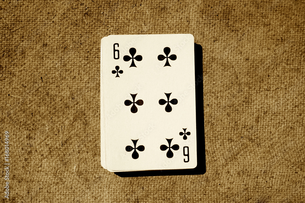 A deck of playing cards on an old wooden background