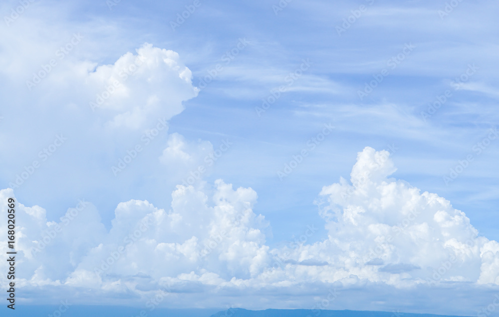bright blue sky with big white cloud background