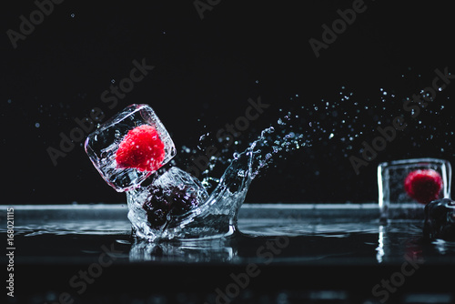 Fototapeta Naklejka Na Ścianę i Meble -  frozen fruits in ice cubes