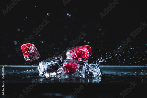 Fototapeta Naklejka Na Ścianę i Meble -  frozen fruits in ice cubes