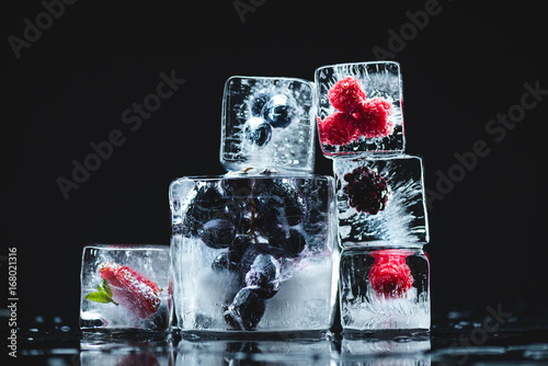 frozen fruits in ice cubes photo