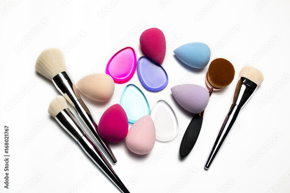 Set of makeup brushes, beauty blenders, silicone sponges and oval brush