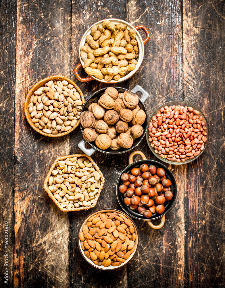 Various nuts in bowls. Various nuts in bowls.