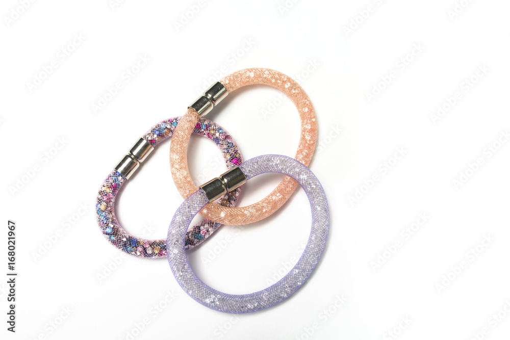 Colorful stylish woman's bracelets on a white background Colorful stylish woman's bracelets on a white background