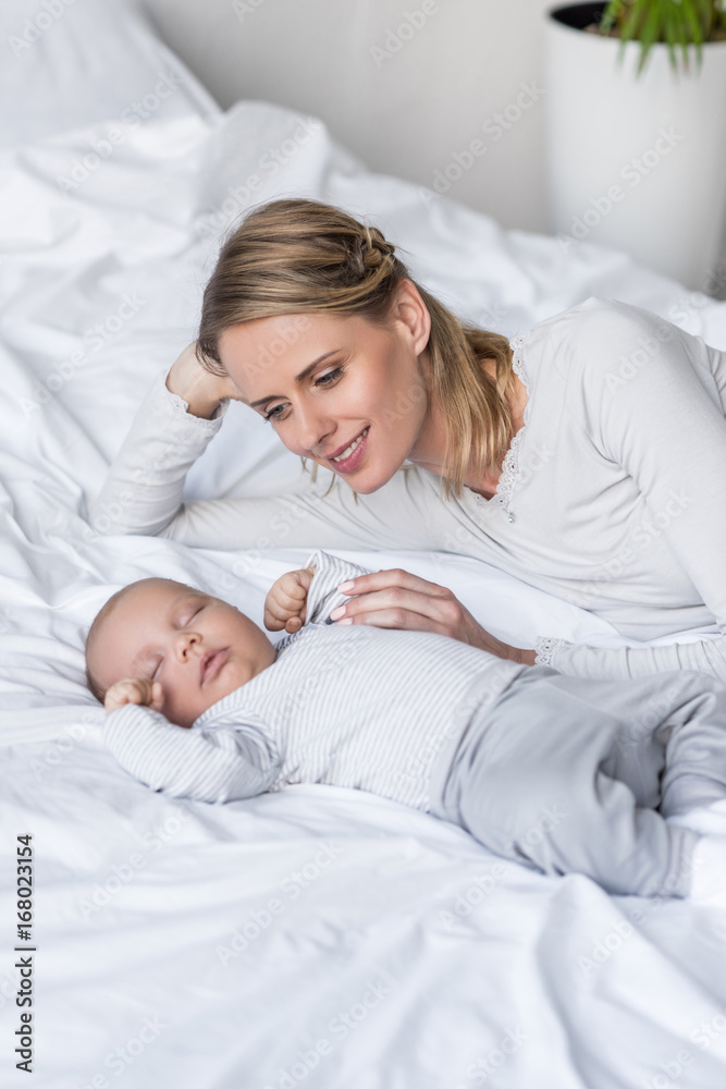 mother with sleeping baby mother with sleeping baby