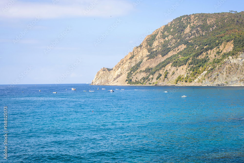 Beautiful daylight view to blue sea and green mountains. Monterosso al Mare, Italy. Cinque Terre