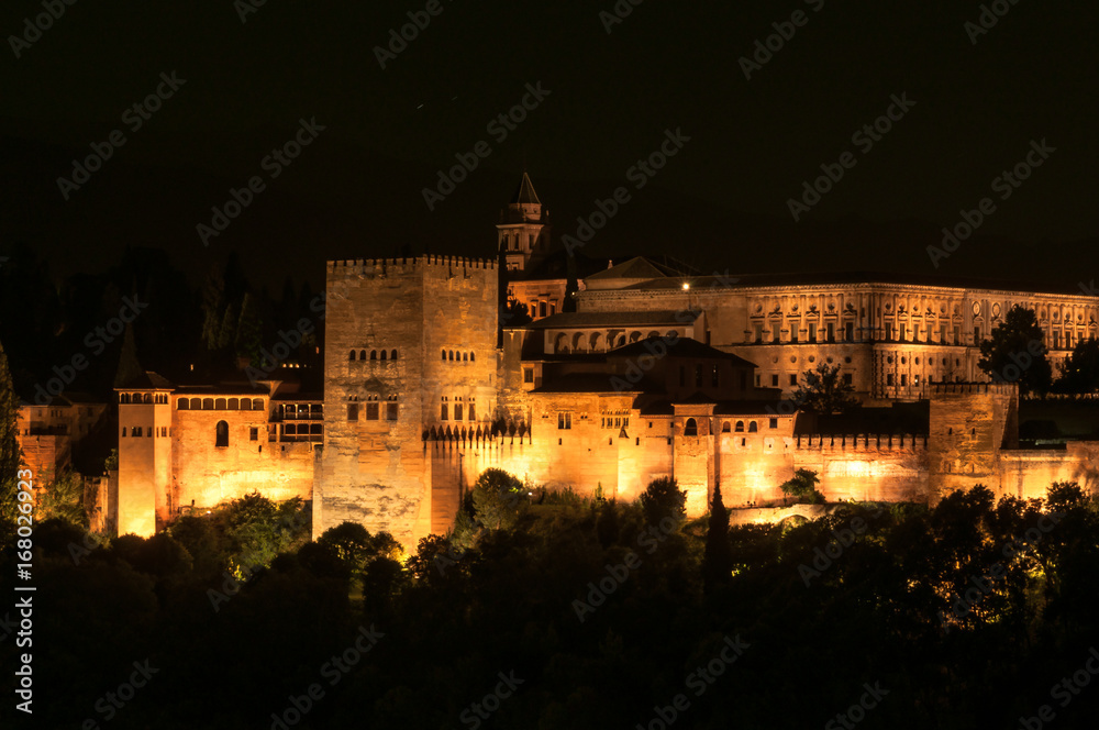 Illuminted buldings of Alhambra complex at night in Granada, Spain