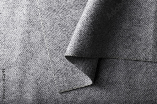  tweed fabric, wool gray herringbone textile background.