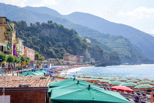 Beautiful daylight view to blue sea and green mountains in fog. Monterosso al Mare, Italy. Cinque Terre © frimufilms