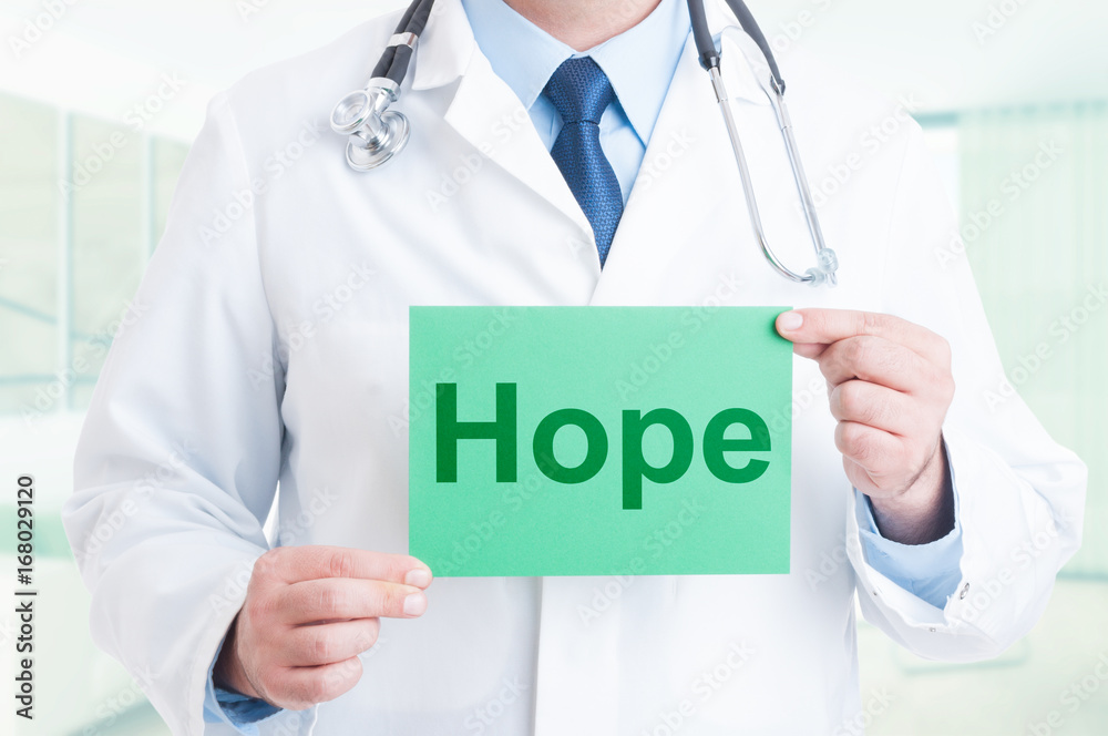Doctor hands holding paper with hope text Doctor hands holding paper with hope text