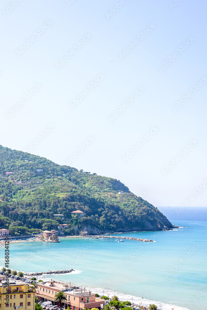 Beautiful daylight view to green mountains, blue sea and buildings of Levanto, Italy. Cinque Terre beauties