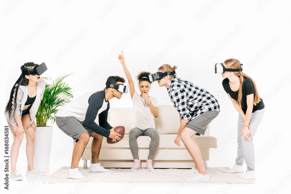 Naklejka premium multiethnic friends in virtual reality headsets