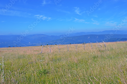 Natural mountain landscape with sky and grass