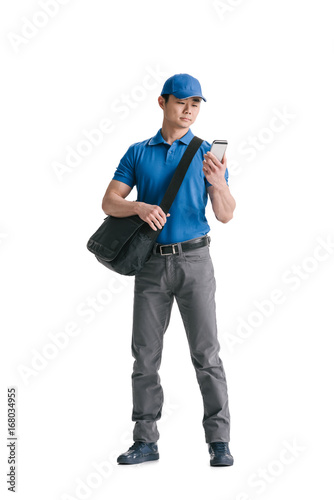 young asian courier with smartphone