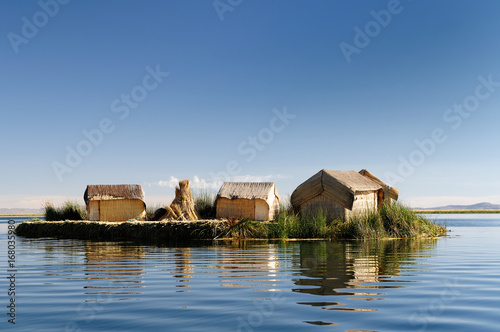 Peru Floating Uros islands on the Titicaca lake the largest highaltitude lake in the world (3808m). Theyre built using the buoyant totora reeds that grow abundantly in the shallows of the lake photo