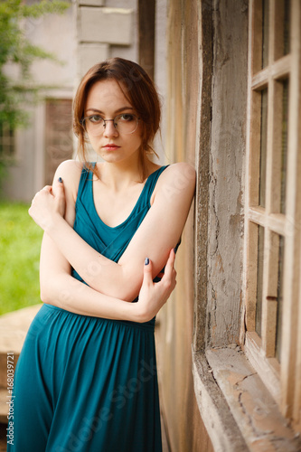 Portrait of young woman by ancient wall