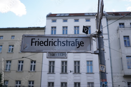 Berlin, Germany - August 13, 2017: Friedrichstrasse street sign name. The Friedrichstraße is a major culture and shopping street in central Berlin