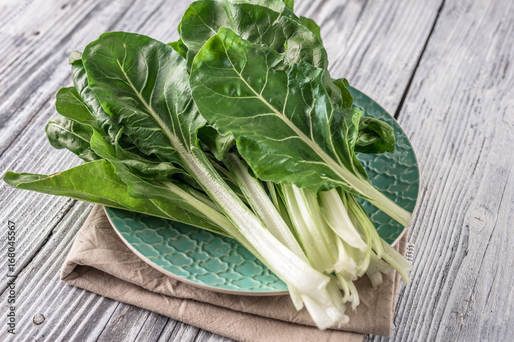 Fresh organic chard on a rustic background Fresh organic chard on a rustic background