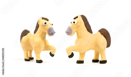 Cute horse modeling clay isolated on white background. Handmade plasticine. Close up. © component